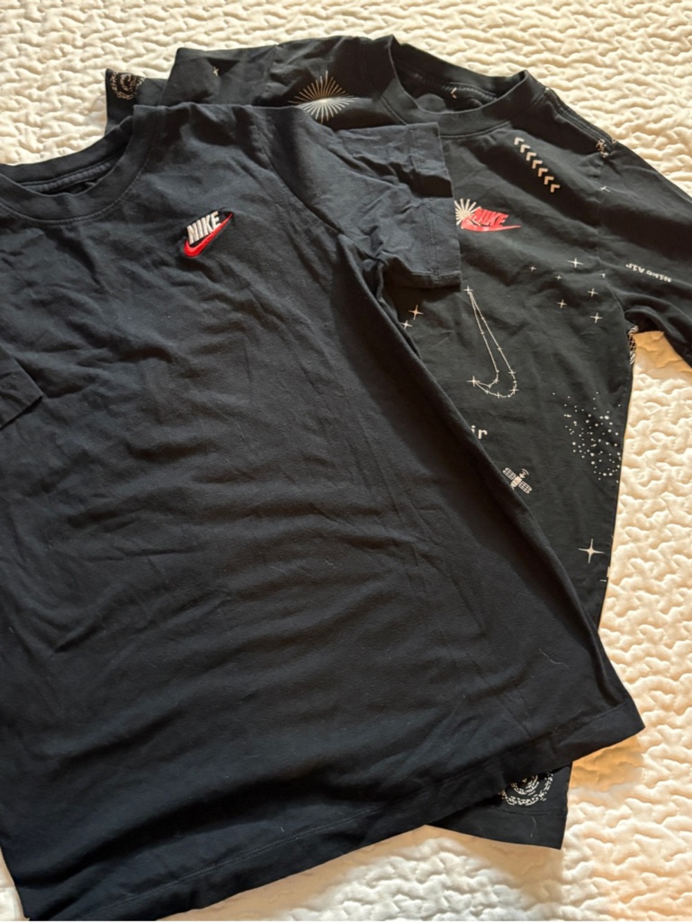 Two “the Nike tees” Black size large